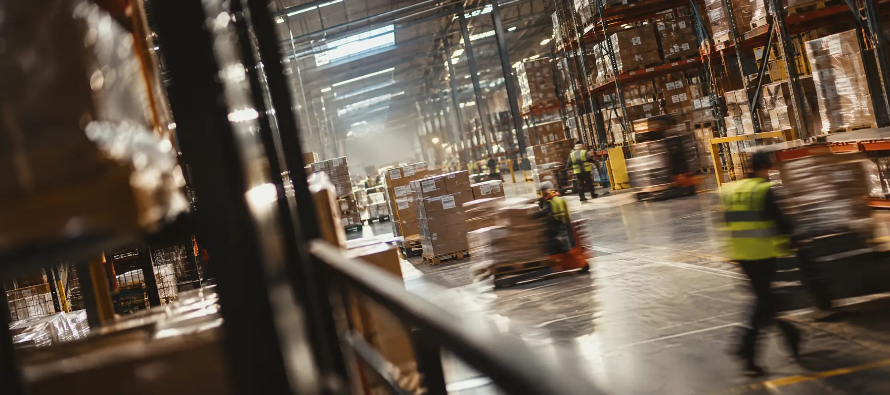 A busy warehouse floor with pallets on the move